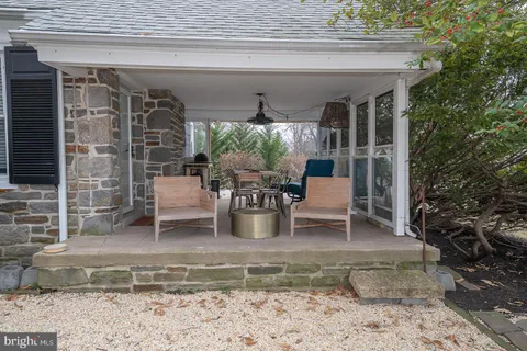 a view of a chairs and table in a patio