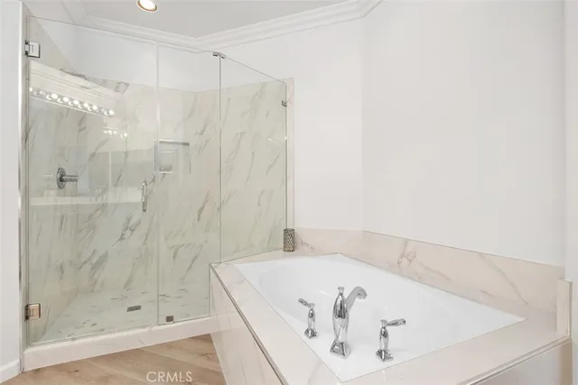 a bathroom with a bathtub and shower