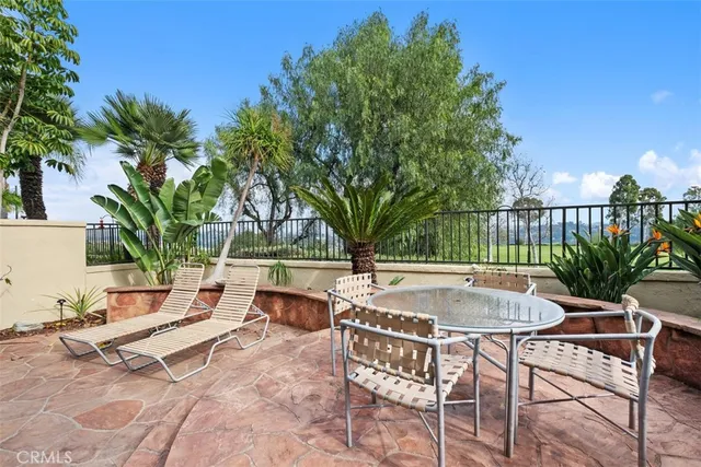 a view of backyard with swimming pool and outdoor seating