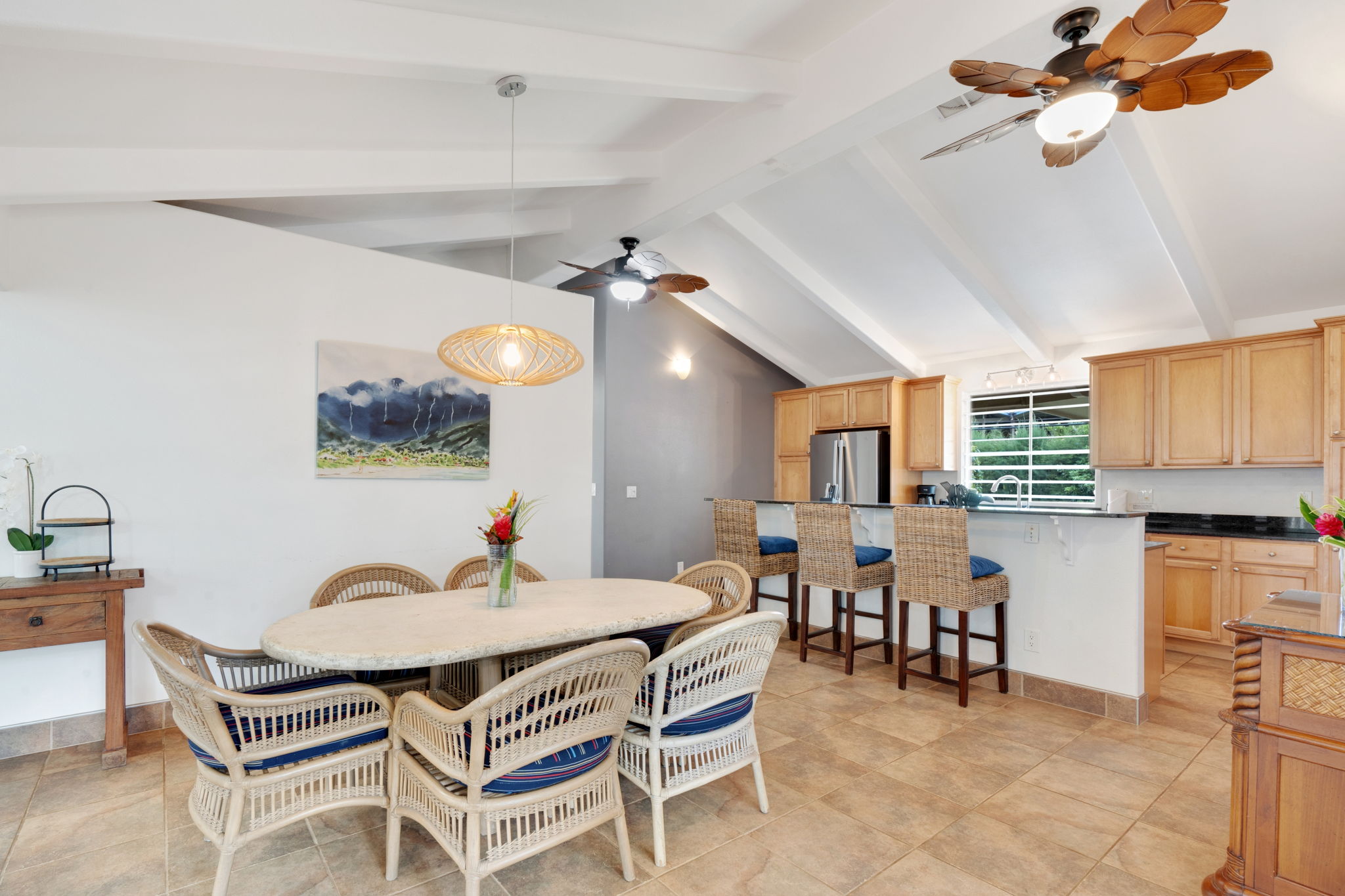 4460 Aku Road Hanalei, HI 96714 - Photo 12 of 30 a living room with furniture a dining table and chairs with wooden floor