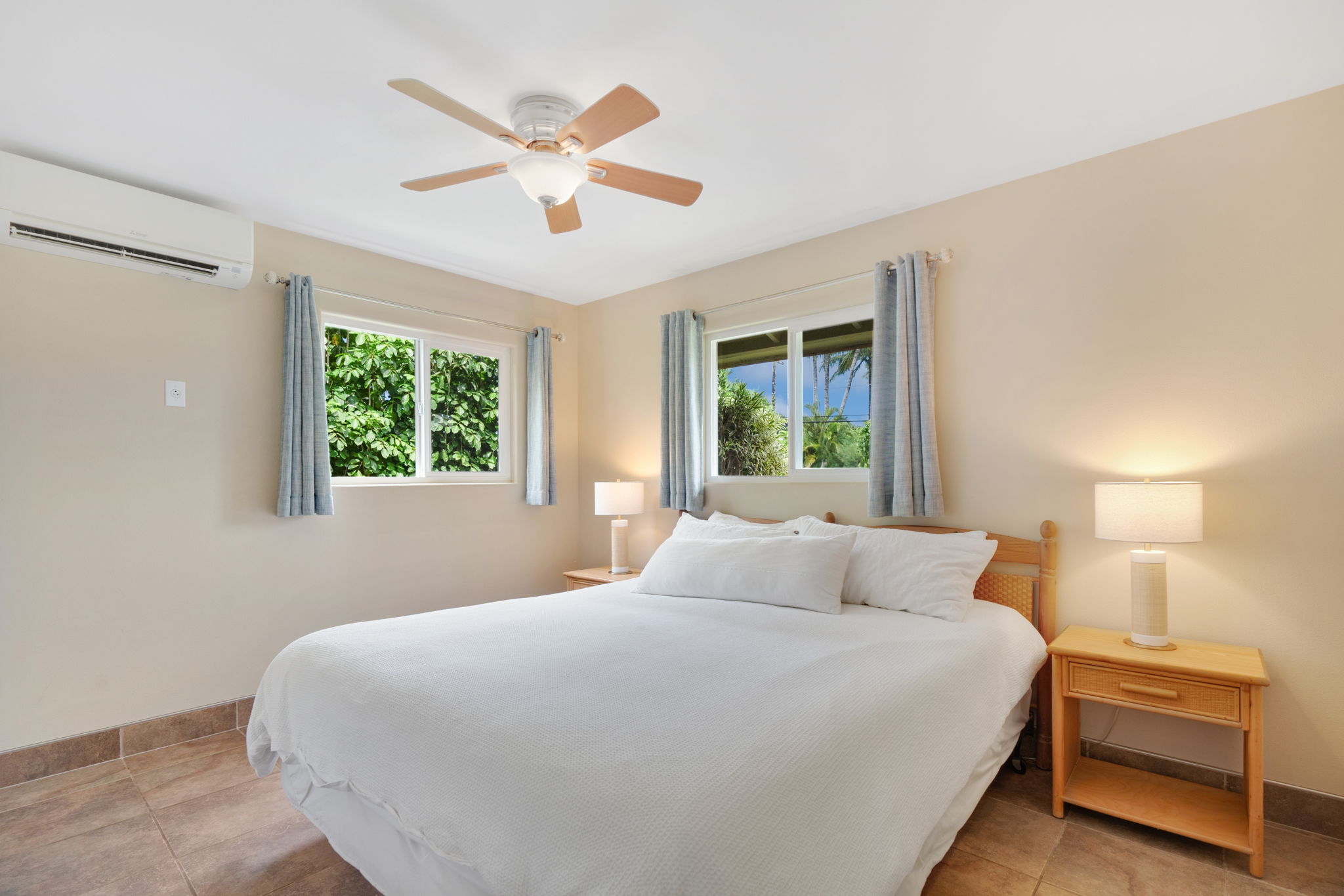 4460 Aku Road Hanalei, HI 96714 - Photo 13 of 30 a bedroom with a large bed and a window