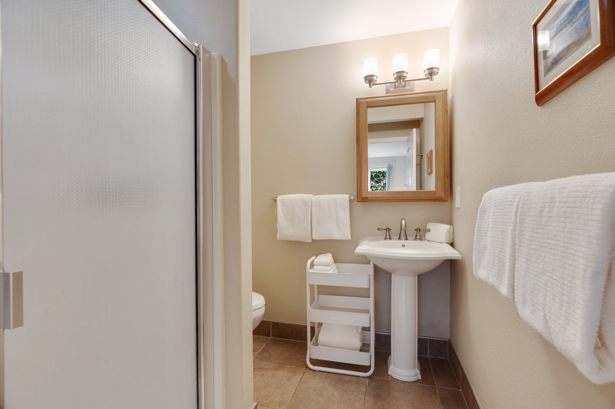 4460 Aku Road Hanalei, HI 96714 - Photo 15 of 30 a bathroom with a sink and a mirror
