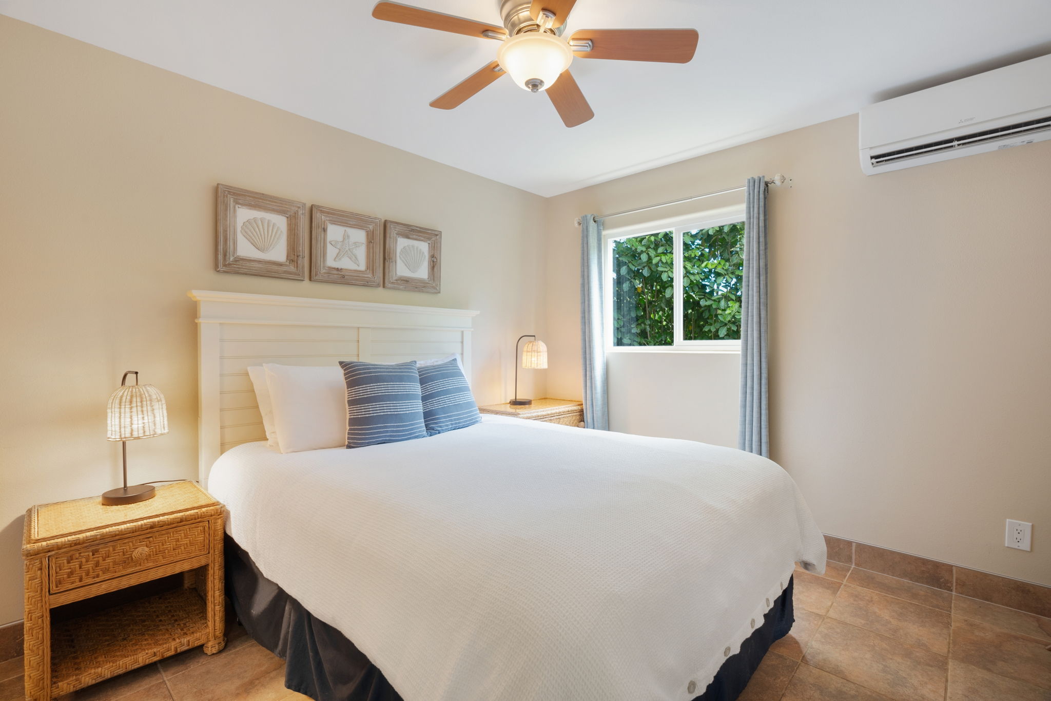 4460 Aku Road Hanalei, HI 96714 - Photo 16 of 30 a bedroom with a bed and a chandelier