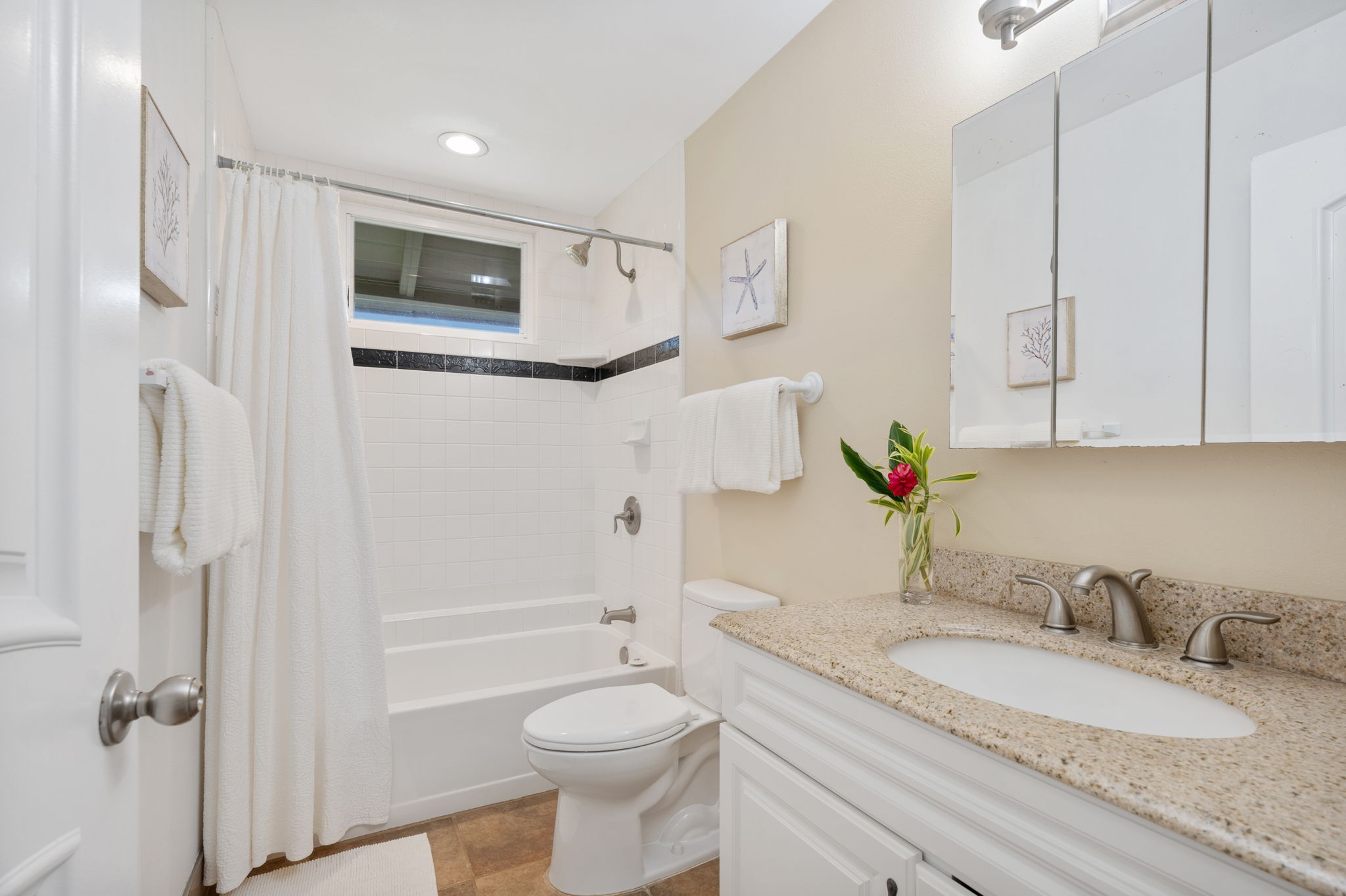 4460 Aku Road Hanalei, HI 96714 - Photo 18 of 30 a bathroom with a granite countertop sink toilet and shower