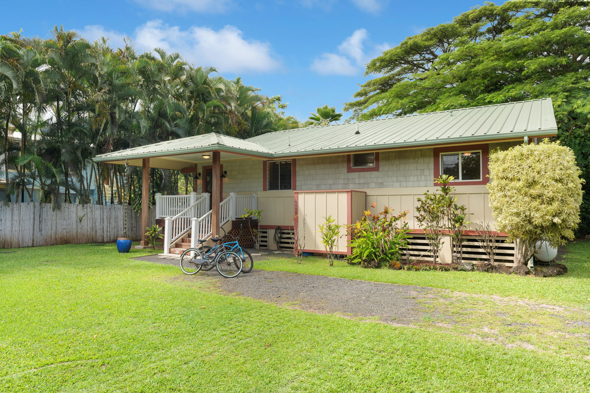 4460 Aku Road Hanalei, HI 96714 - Photo 2 of 30 a front view of a house with patio
