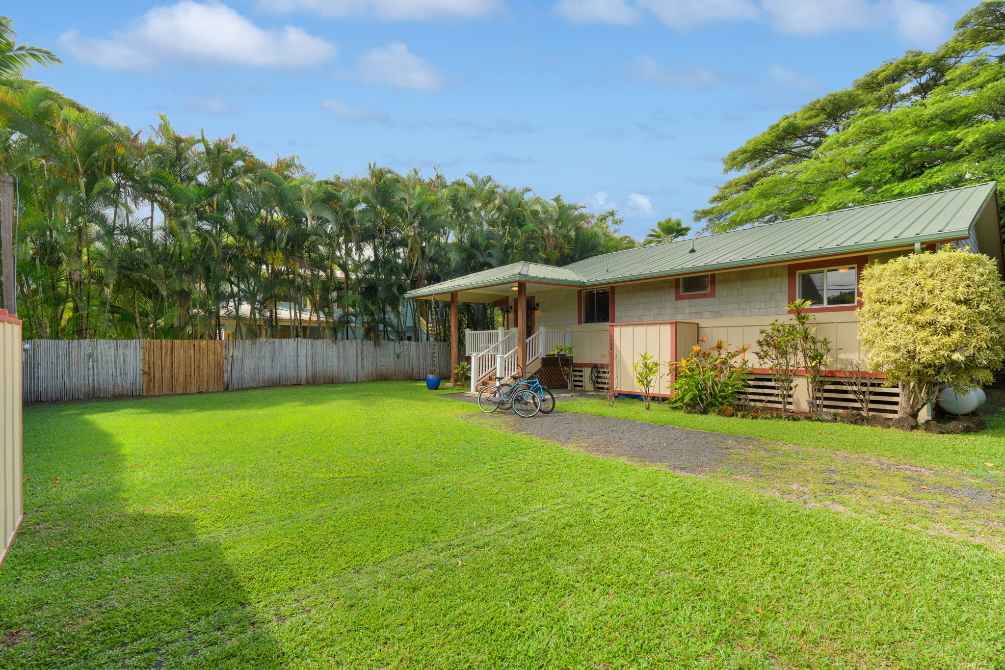 4460 Aku Road Hanalei, HI 96714 - Photo 3 of 30 a view of a house with backyard and porch