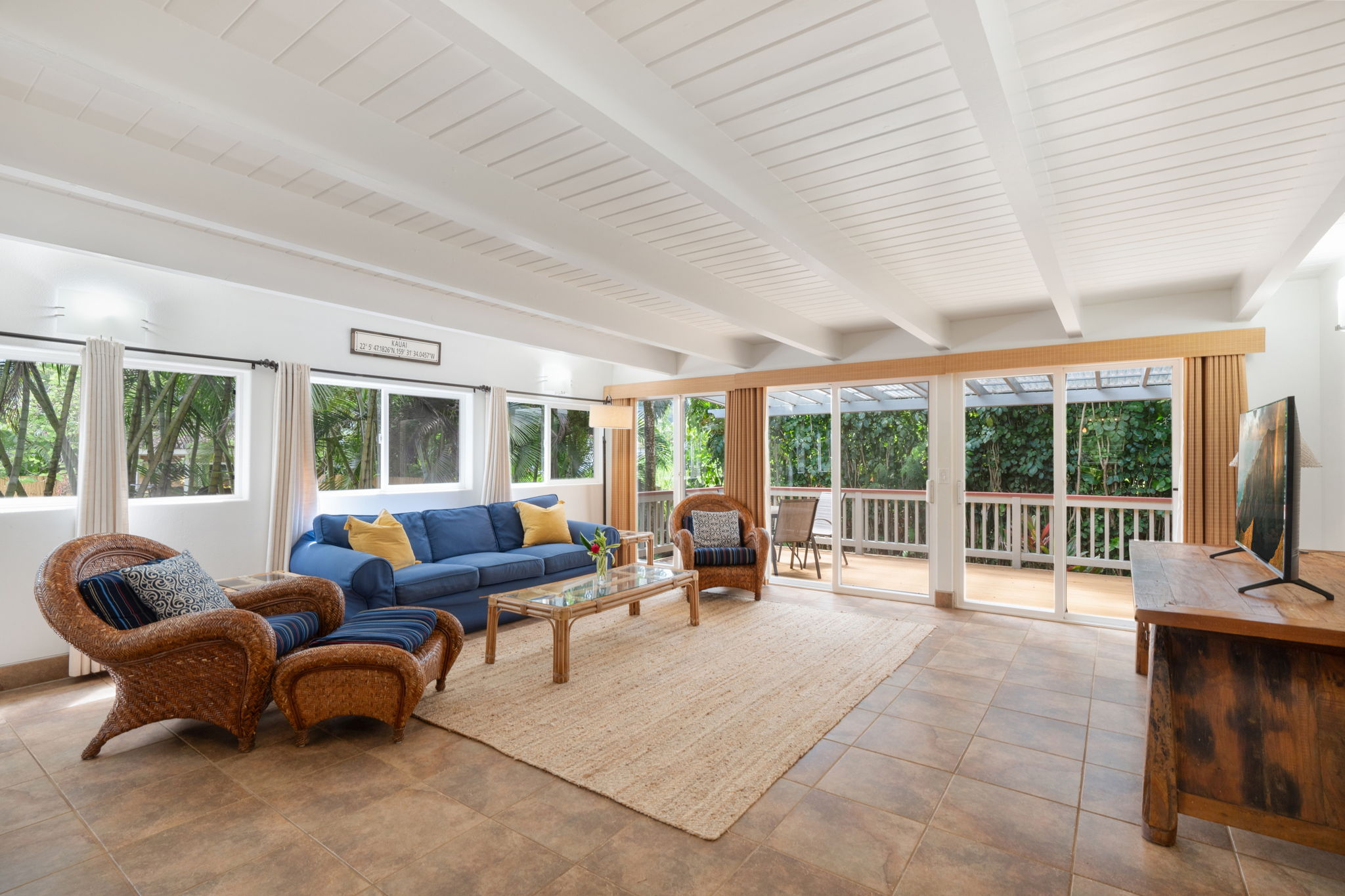 4460 Aku Road Hanalei, HI 96714 - Photo 6 of 30 a living room with furniture and large windows