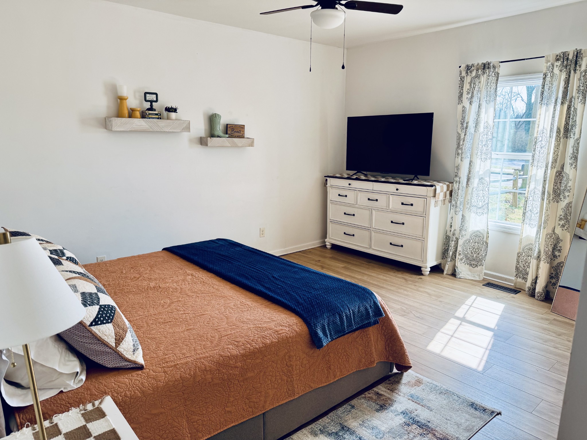 105 Riverside Drive, Unit A Columbia, TN 38401 - Photo 7 of 17 a bedroom with furniture and flat screen tv