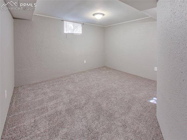 1904 North Chelton Road Colorado Springs, CO 80909 - Photo 20 of 31 Basement Bedroom