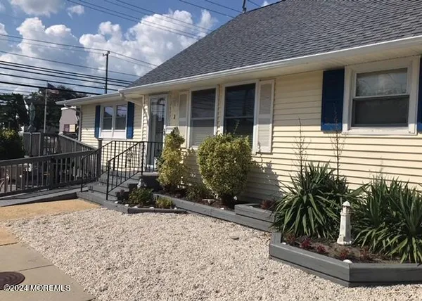 a view of a porch with potted plants