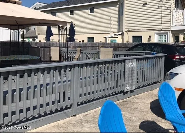 a view of a deck with a wooden fence