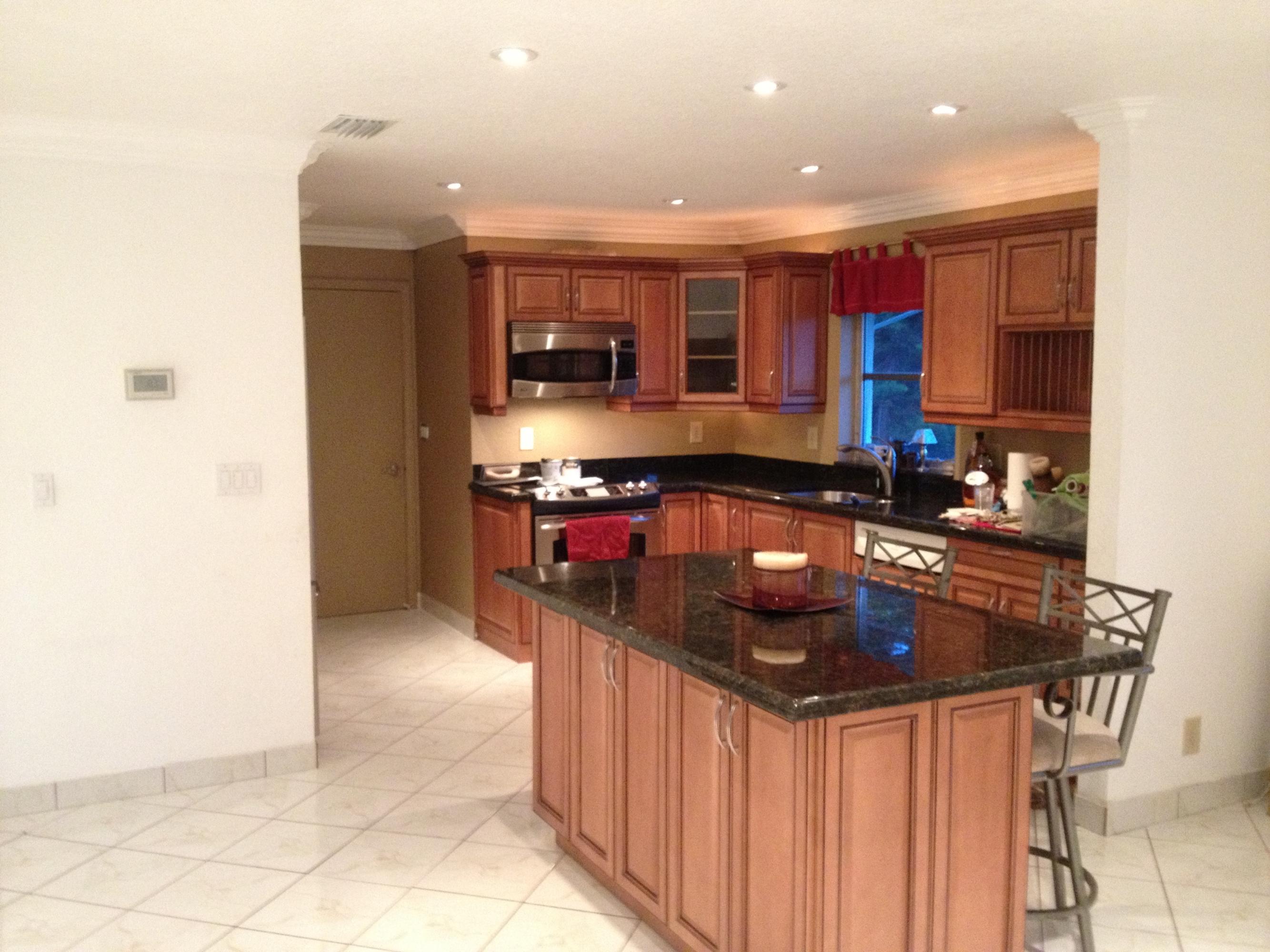6014 Dusenburg Road Delray Beach, FL 33484 - Photo 7 of 25 kitchen with lights on and lights behind
