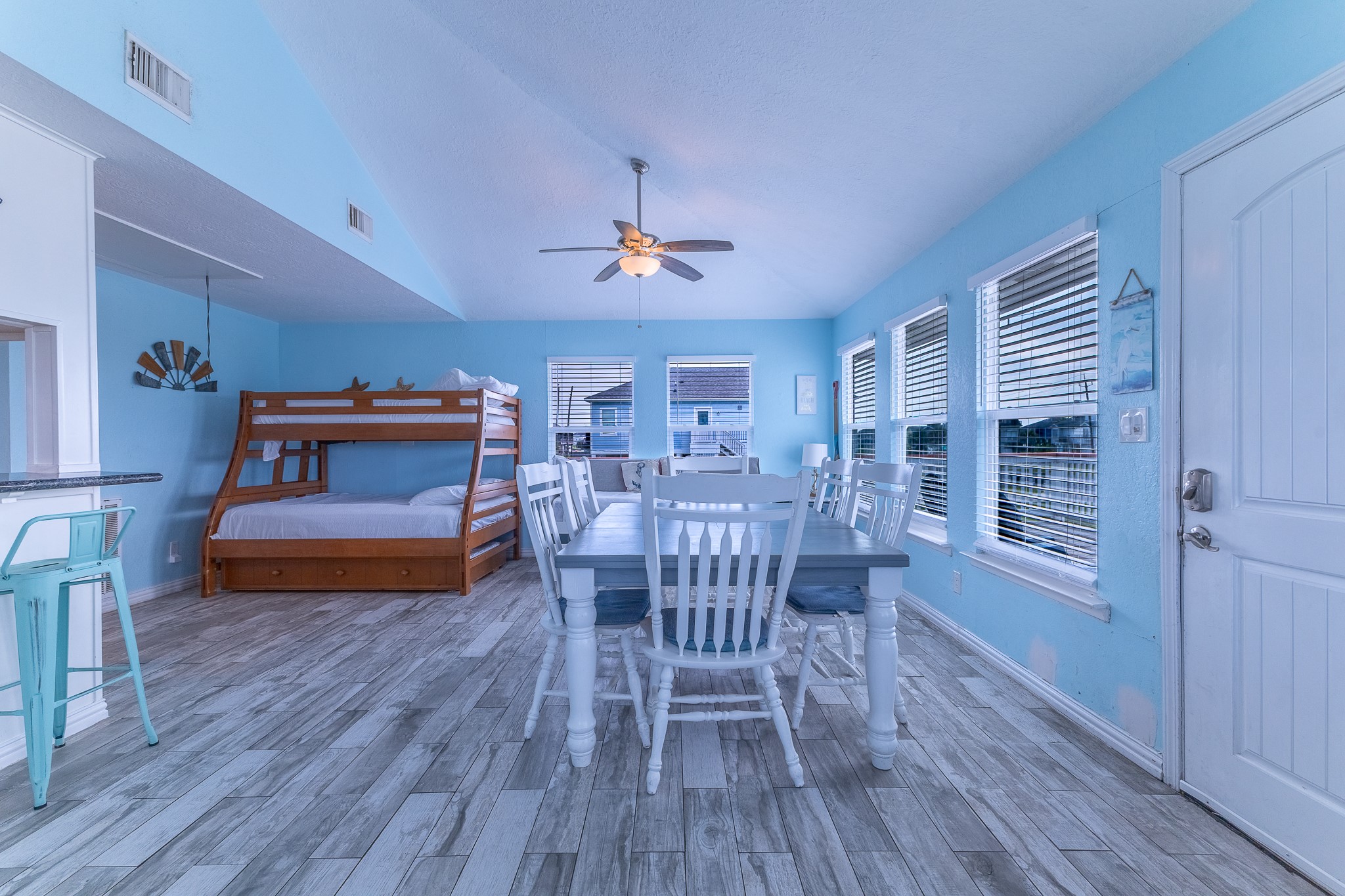 21614 Termini-San Luis Pass Road Galveston, TX 77554 - Photo 12 of 31 a living room with furniture and a wooden floor