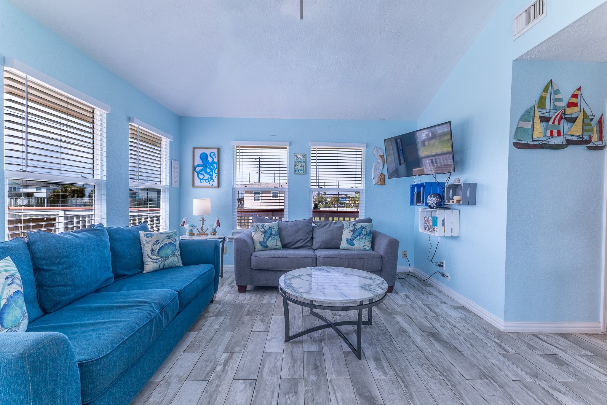 21614 Termini-San Luis Pass Road Galveston, TX 77554 - Photo 13 of 31 a living room with furniture and a wooden floor