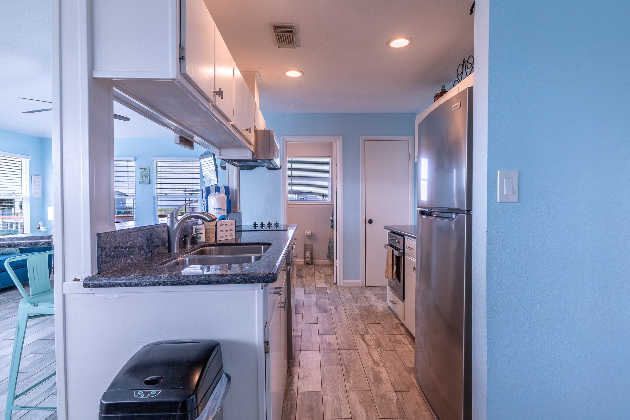 21614 Termini-San Luis Pass Road Galveston, TX 77554 - Photo 19 of 31 a kitchen with stainless steel appliances granite countertop a refrigerator and a sink