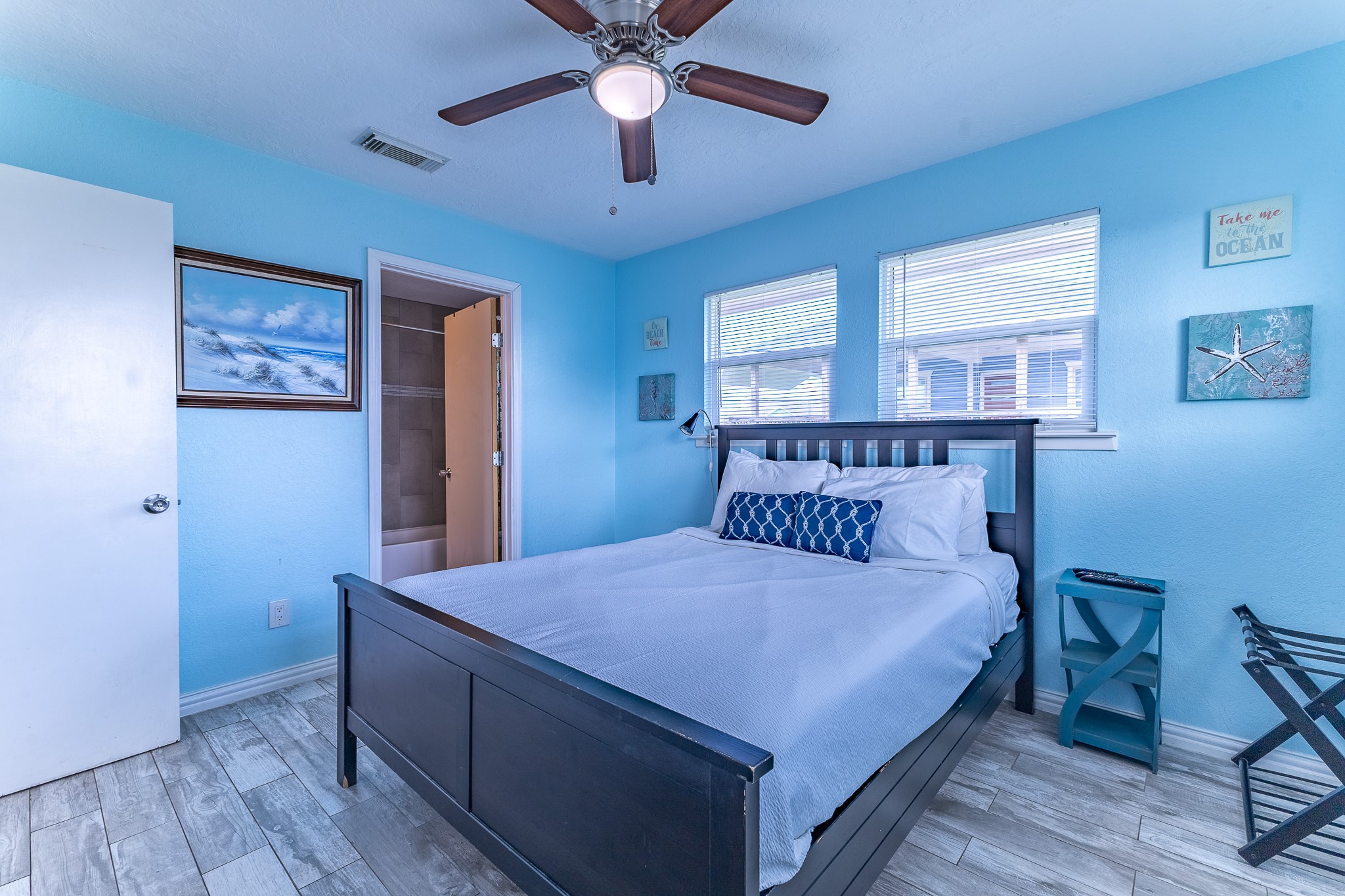 21614 Termini-San Luis Pass Road Galveston, TX 77554 - Photo 20 of 31 a bedroom with a bed and a chandelier