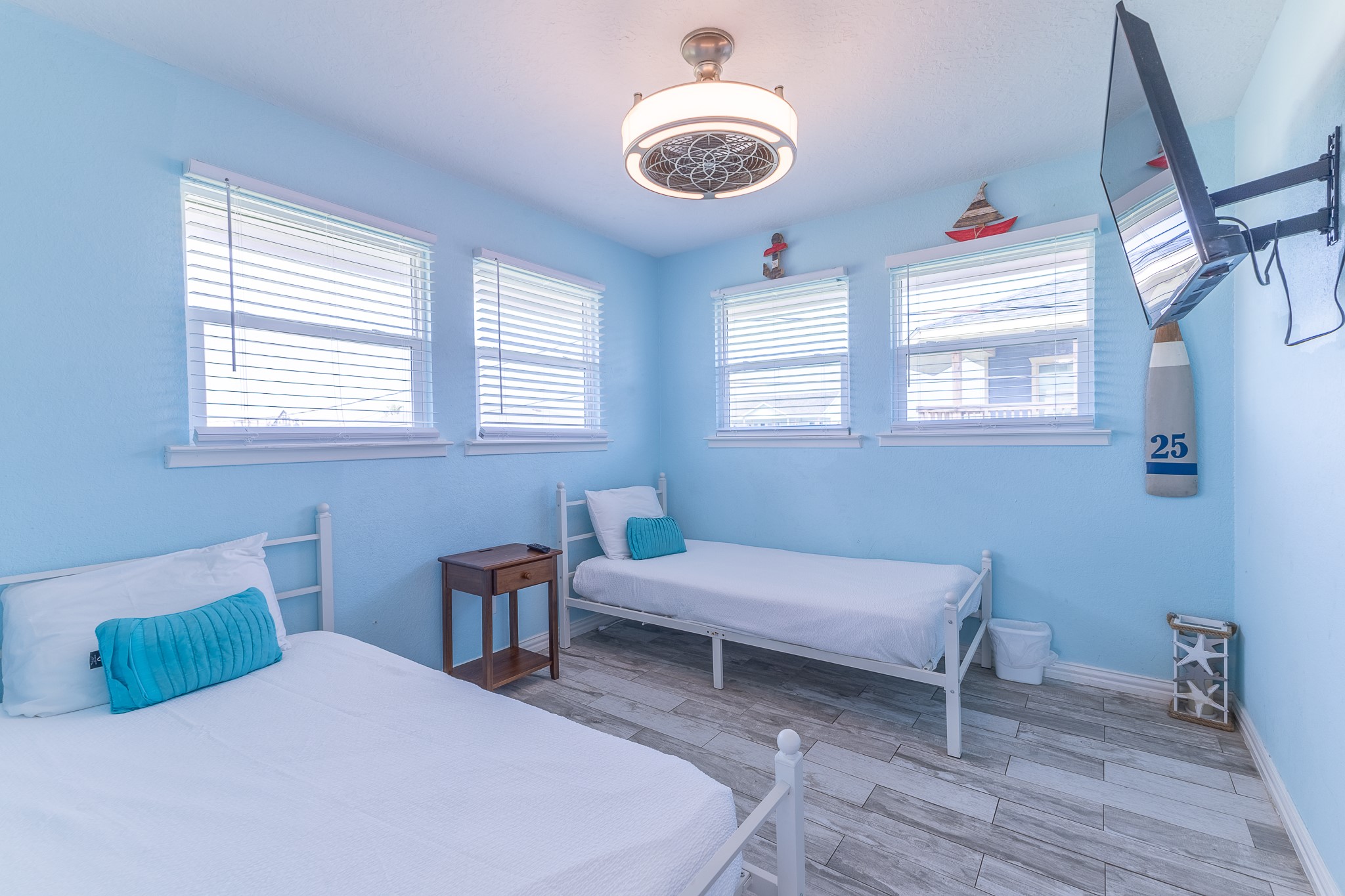 21614 Termini-San Luis Pass Road Galveston, TX 77554 - Photo 22 of 31 a bedroom with a bed and a chandelier