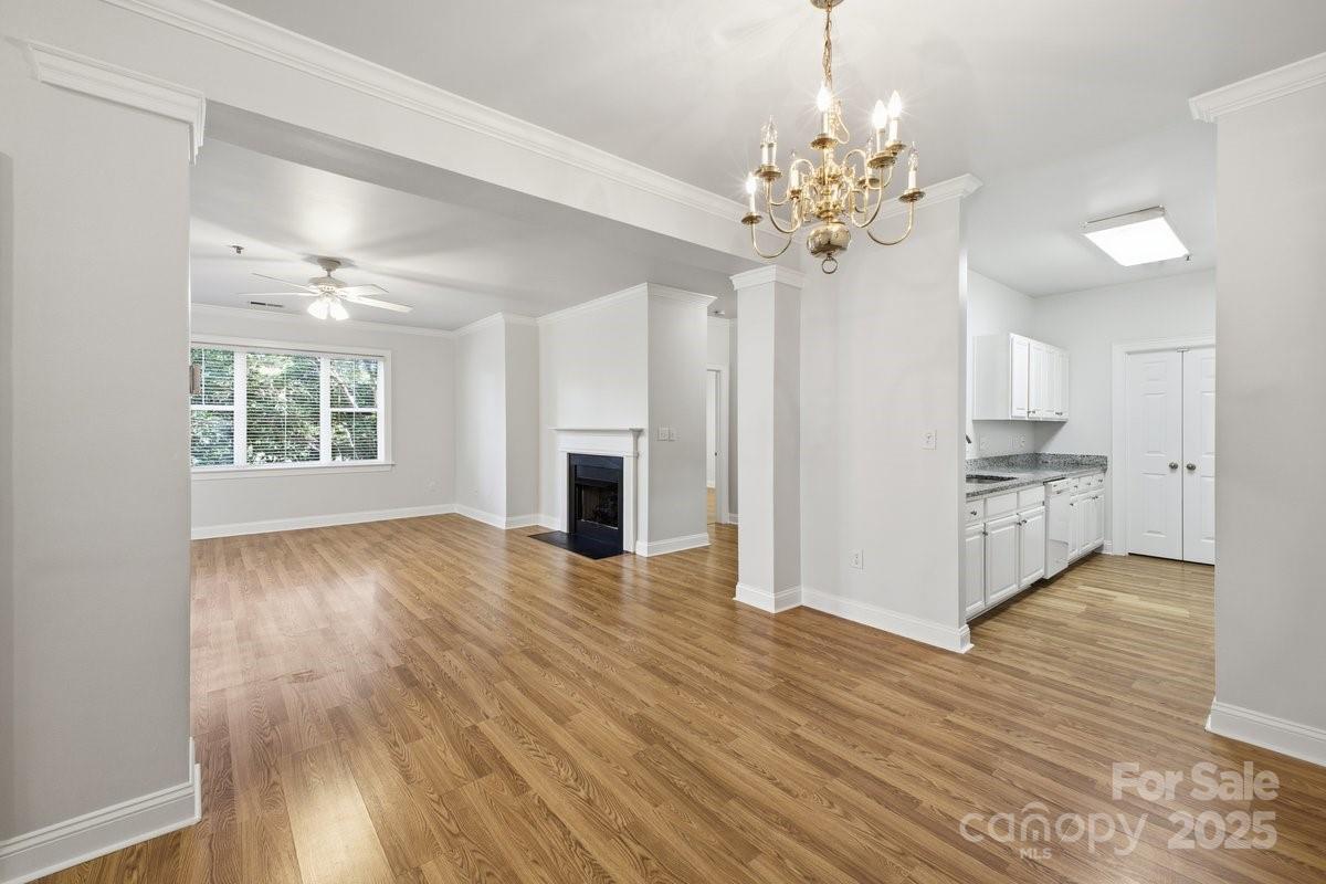 5617 Fairview Road, Unit 6 Charlotte, NC 28209 - Photo 13 of 38 a view of an empty room with window and wooden floor