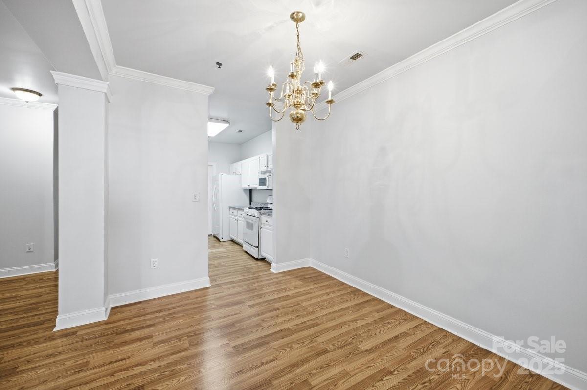 5617 Fairview Road, Unit 6 Charlotte, NC 28209 - Photo 15 of 38 a view of an empty room with wooden floor