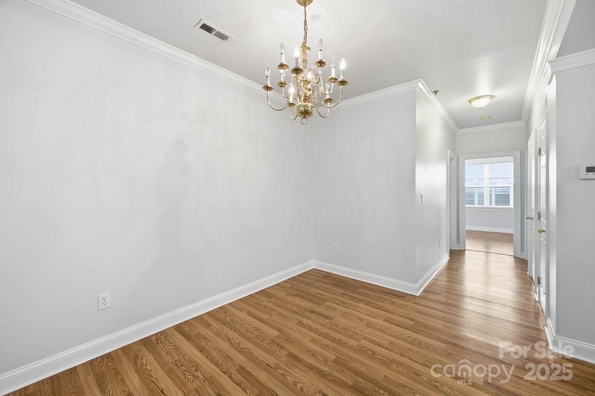 5617 Fairview Road, Unit 6 Charlotte, NC 28209 - Photo 16 of 38 a view of a hallway with wooden floor