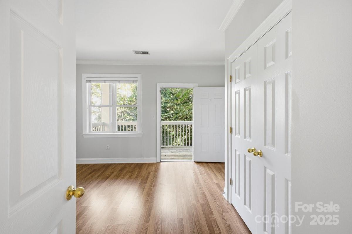 5617 Fairview Road, Unit 6 Charlotte, NC 28209 - Photo 17 of 38 a view of a room with wooden floor and window