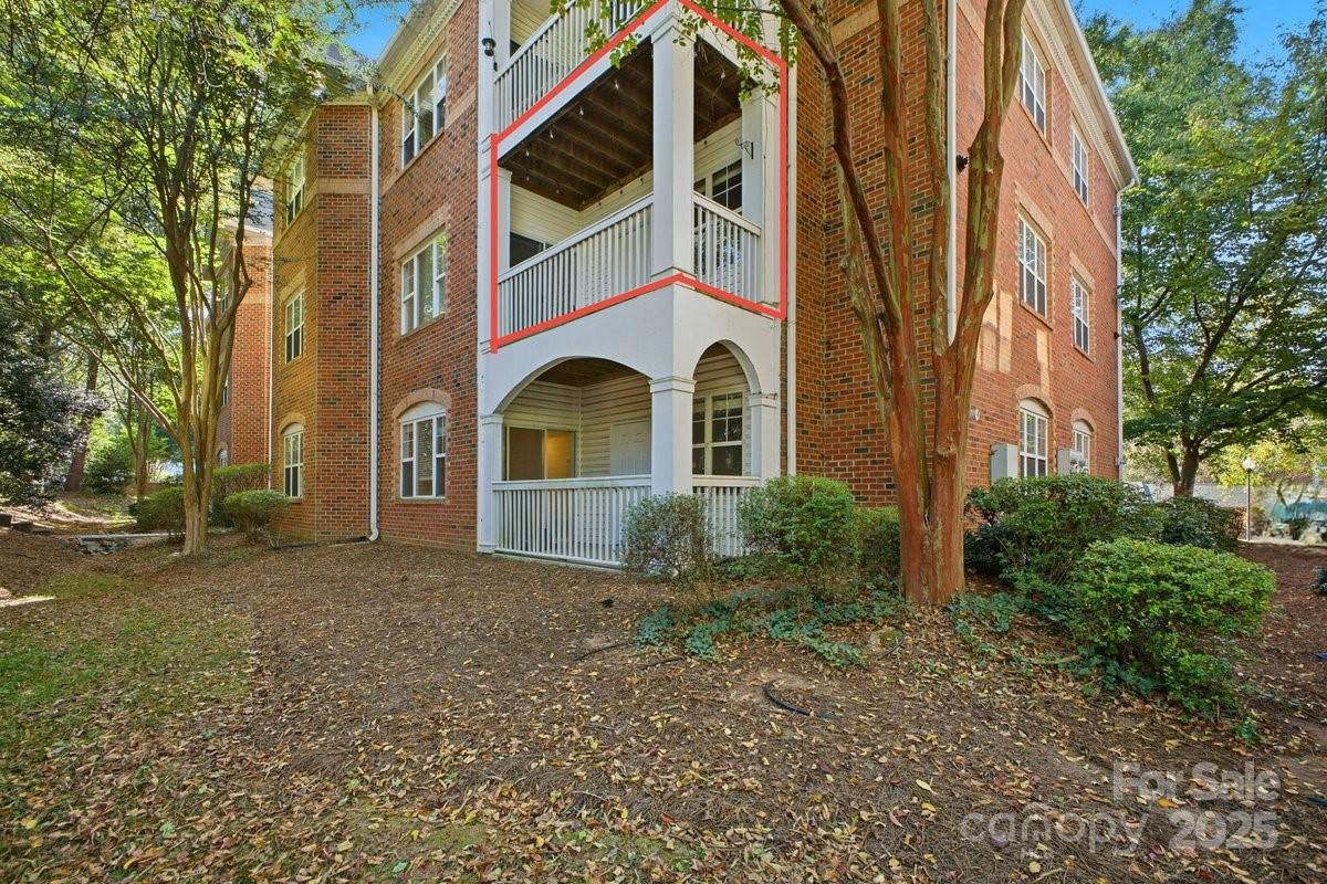 5617 Fairview Road, Unit 6 Charlotte, NC 28209 - Photo 2 of 38 a front view of a house with a yard