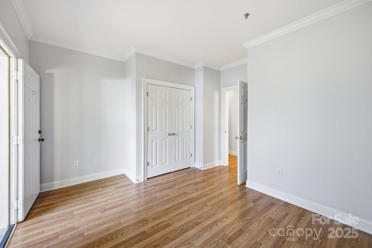 5617 Fairview Road, Unit 6 Charlotte, NC 28209 - Photo 21 of 38 a view of an empty room with wooden floor