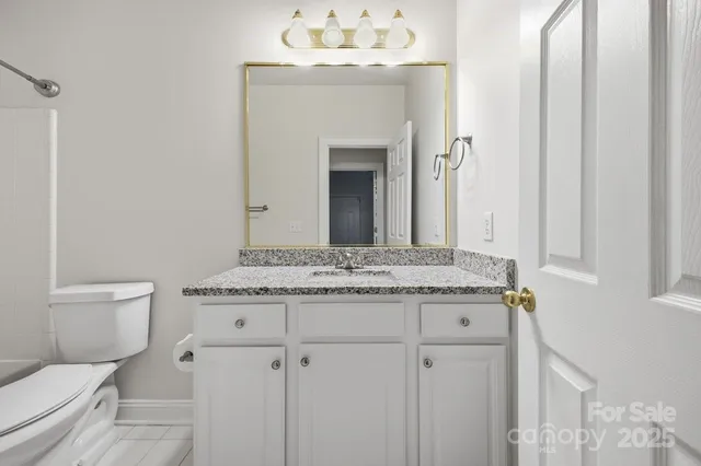 a bathroom with a toilet and a bathtub