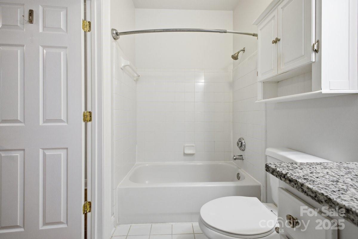 5617 Fairview Road, Unit 6 Charlotte, NC 28209 - Photo 25 of 38 a bathroom with a toilet and a bathtub