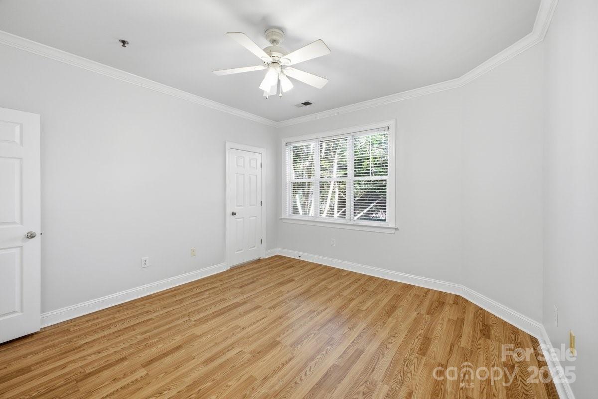5617 Fairview Road, Unit 6 Charlotte, NC 28209 - Photo 27 of 38 wooden floor in an empty room with a window
