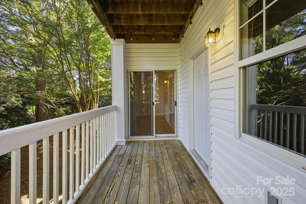 5617 Fairview Road, Unit 6 Charlotte, NC 28209 - Photo 31 of 38 a view of a balcony with wooden floor