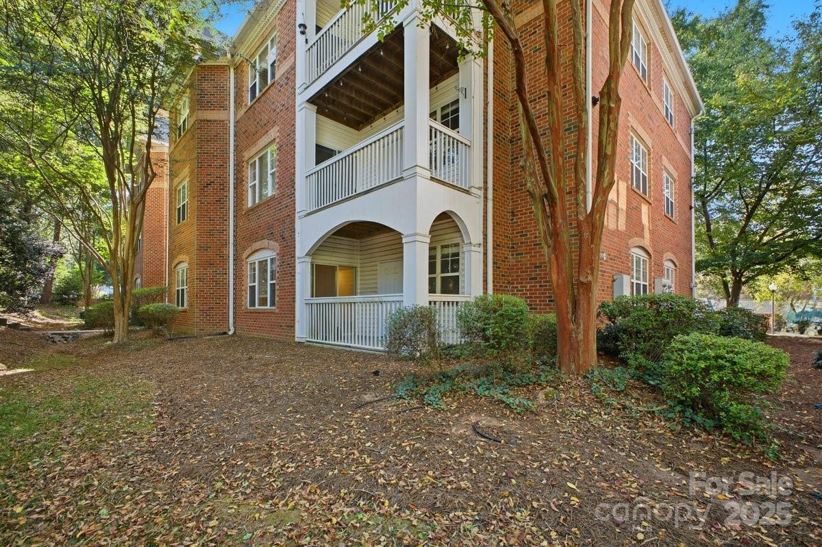 5617 Fairview Road, Unit 6 Charlotte, NC 28209 - Photo 34 of 38 a front view of a house with a yard