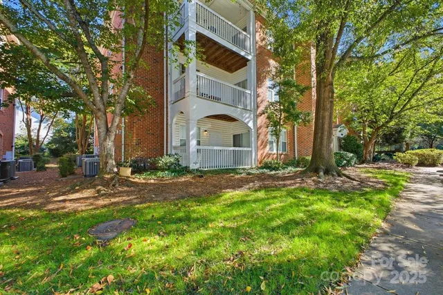 a sign that is sitting in front of flowers