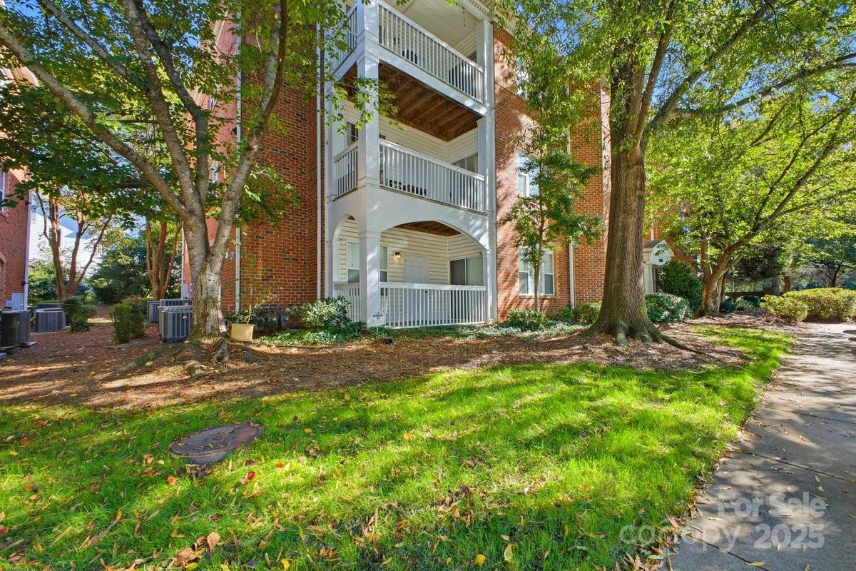 5617 Fairview Road, Unit 6 Charlotte, NC 28209 - Photo 36 of 38 a view of a house with a yard