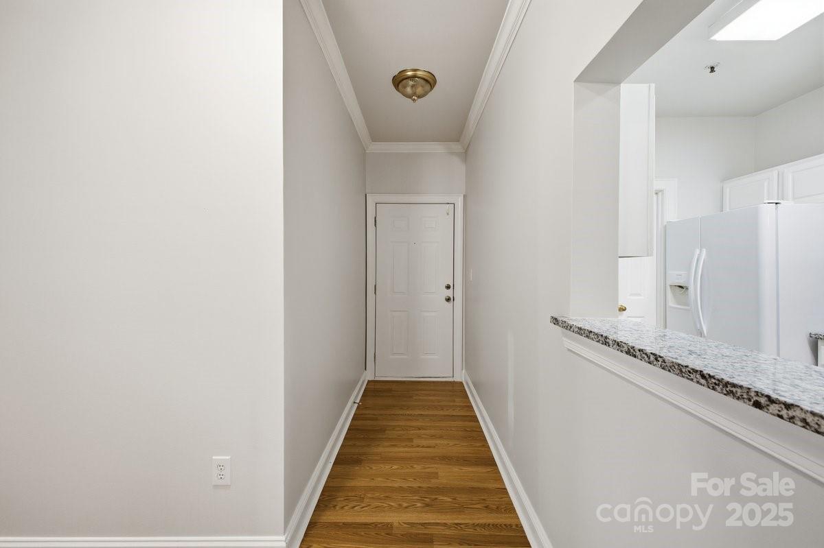 5617 Fairview Road, Unit 6 Charlotte, NC 28209 - Photo 8 of 38 a view of a hallway with wooden floor and staircase
