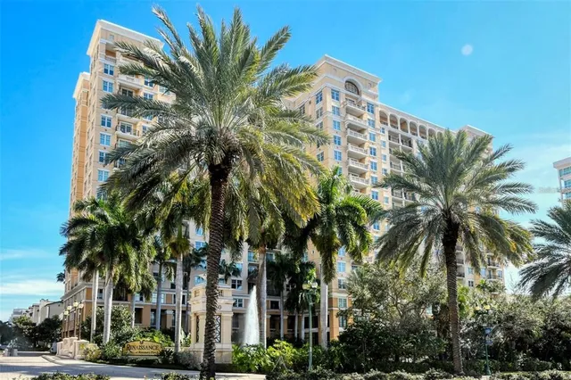 a view of a palm trees in front of a building