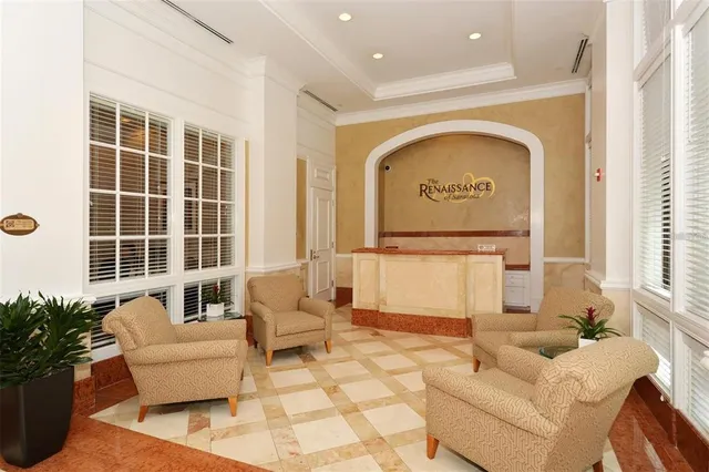 a view of a building with yard and sitting area