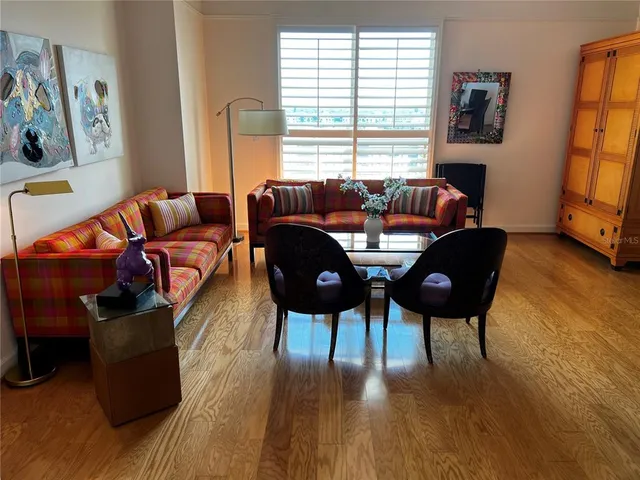 a living room with furniture and a window