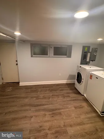 a view of kitchen and empty room