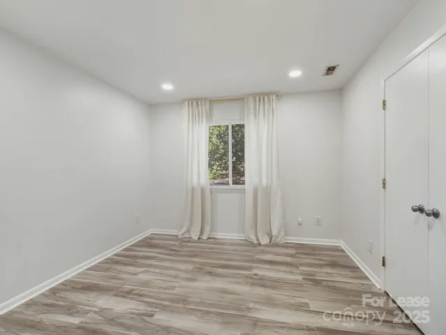 a view of a livingroom with wooden floor