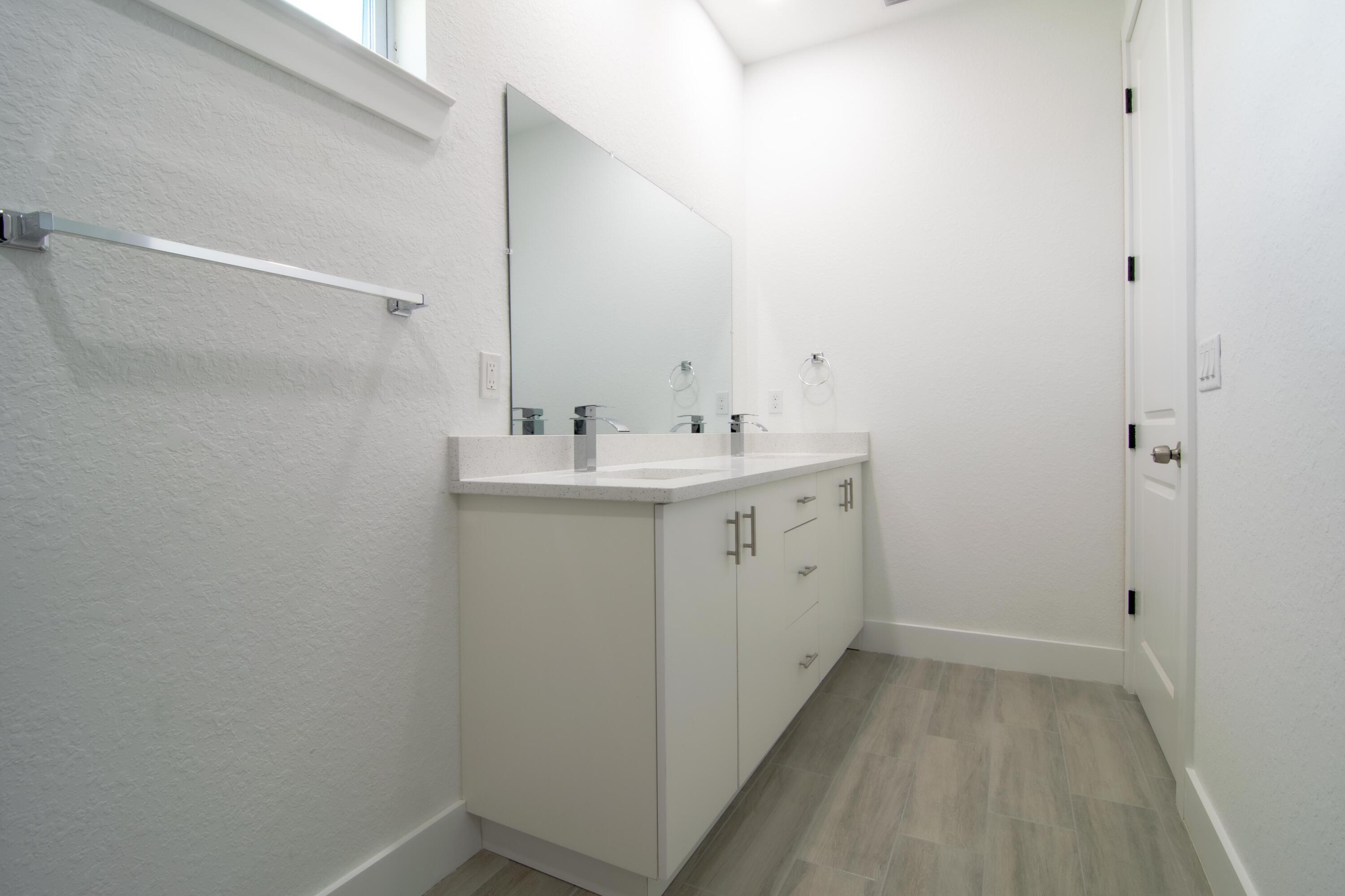 10654 Washington Road Port Charlotte, FL 33981 - Photo 23 of 36 a utility room with cabinets washer and dryer