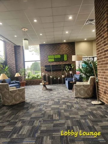 a view of swimming pool with seating space