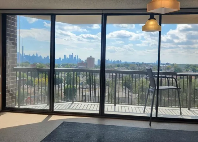 a view of a balcony with floor to ceiling window