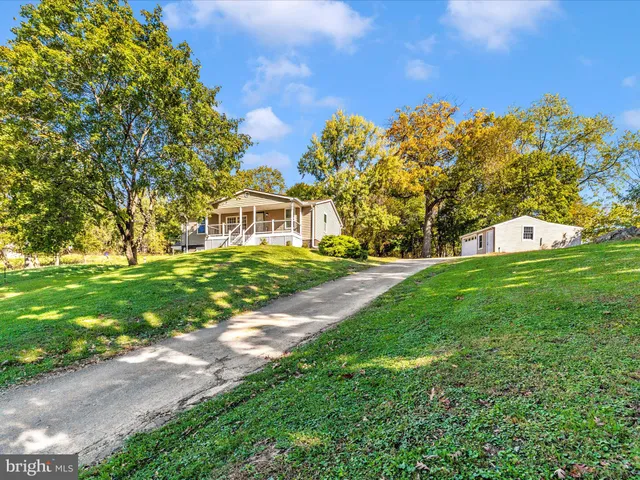 a view of a house with a big yard