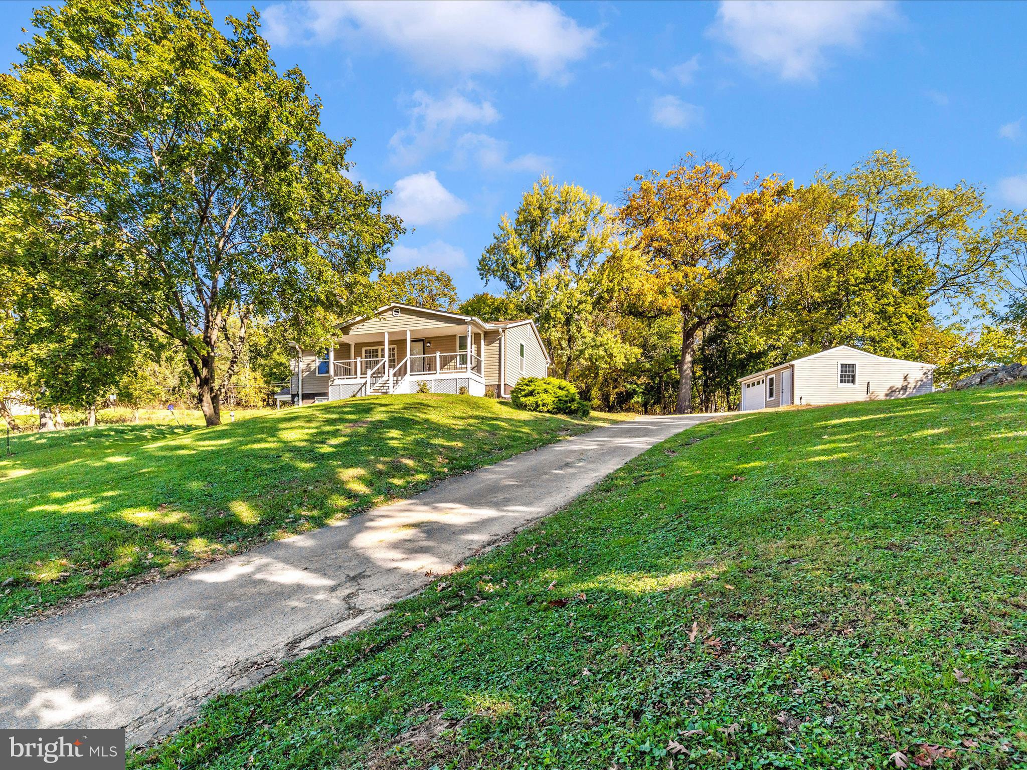 1410 Woodenbridge Lane Mount Airy, MD 21771 - Photo 1 of 50 a view of a house with a big yard