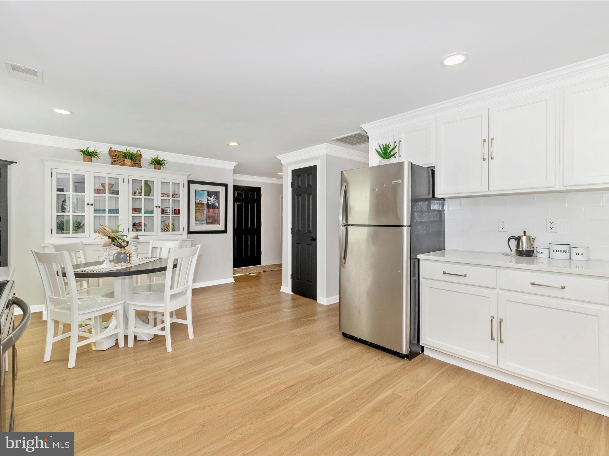 1410 Woodenbridge Lane Mount Airy, MD 21771 - Photo 15 of 50 a kitchen with stainless steel appliances granite countertop a refrigerator and a stove top oven