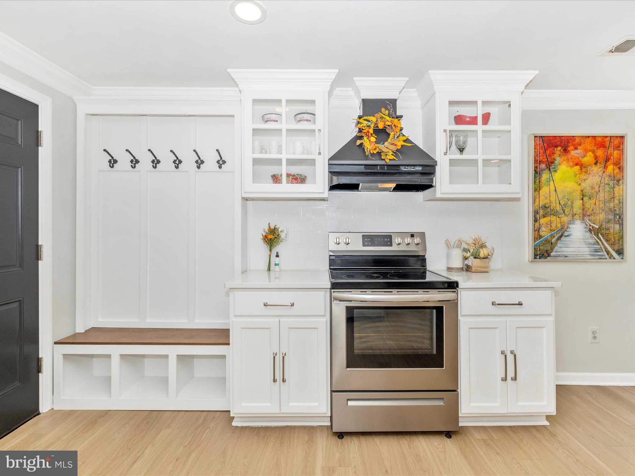 1410 Woodenbridge Lane Mount Airy, MD 21771 - Photo 17 of 50 a kitchen with stainless steel appliances granite countertop a stove and a microwave