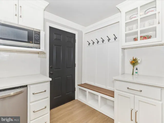 a kitchen with a refrigerator and a stove