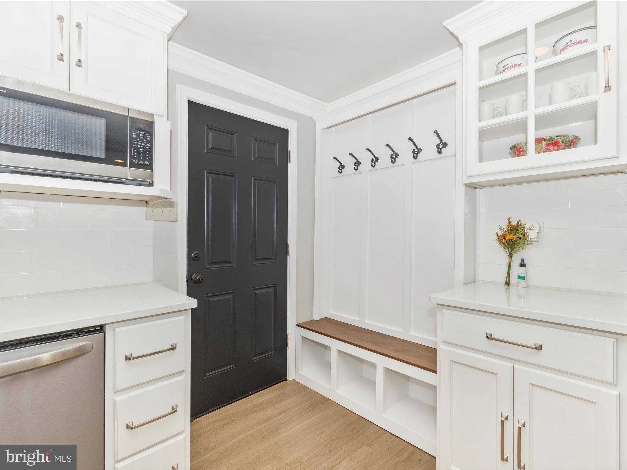 1410 Woodenbridge Lane Mount Airy, MD 21771 - Photo 18 of 50 a kitchen with a refrigerator and a stove