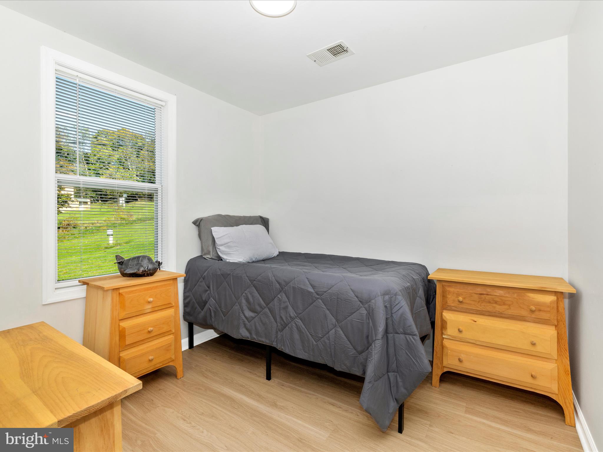 1410 Woodenbridge Lane Mount Airy, MD 21771 - Photo 23 of 50 a bedroom with a bed and a window